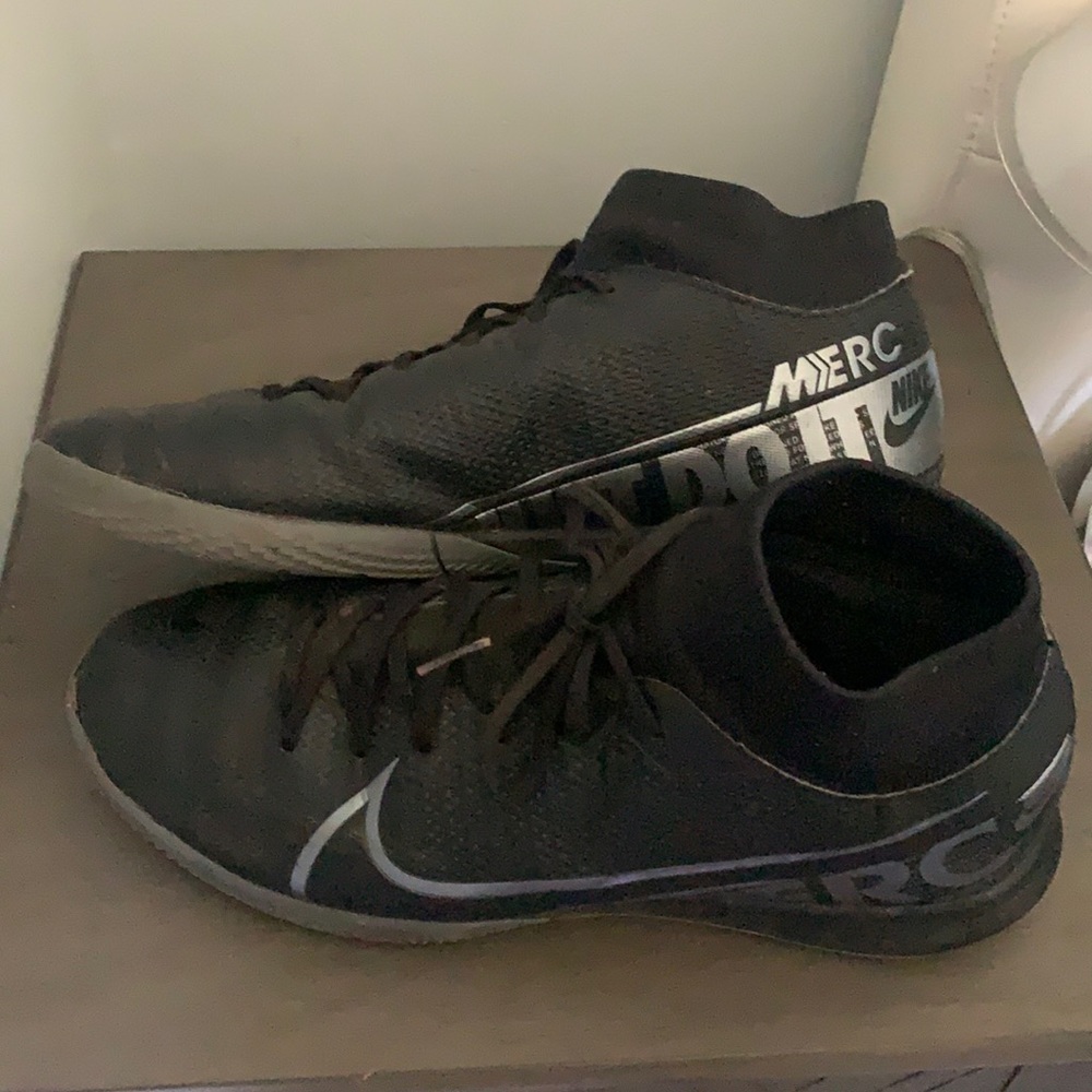 Nike Black indoor soccer shoes.